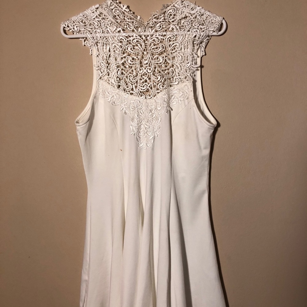White laced neckline, sleeveless dress